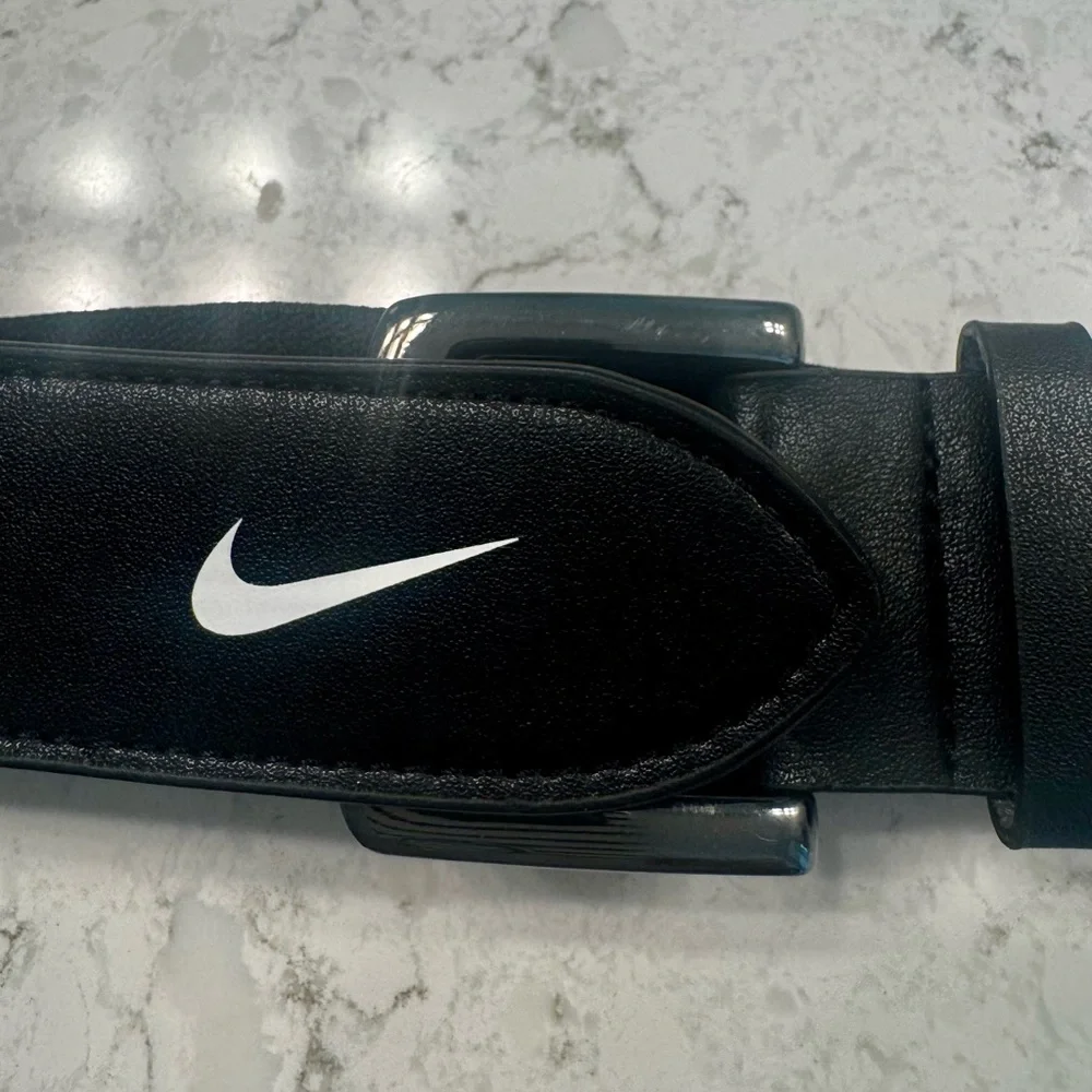 Nike Black Belt and yellow adidas baseball or softball belts